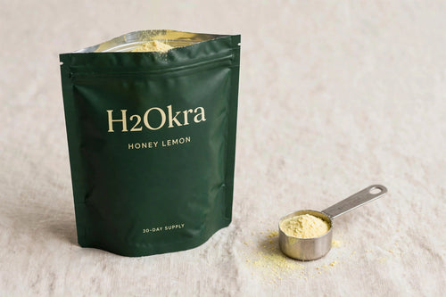H2Okra okra water powder in Green Tea, Honey & Lime, 30-day pouch with a scoop of powder